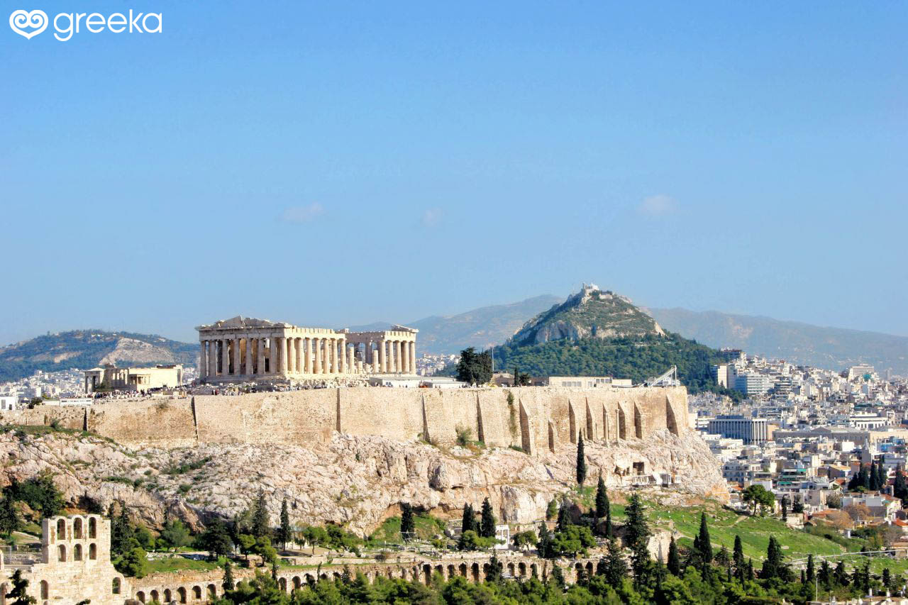 The prominent location of the monuments atop the Acropolis, overlooking the city of Athens