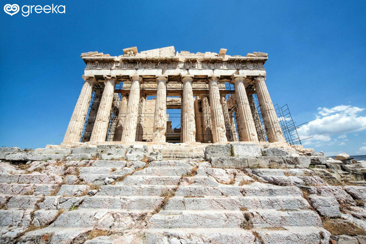 The facade of the imposing Parthenon on the Acropolis of Athens, featuring eight Doric columns